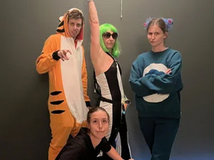 Team members in costumes at a community event.